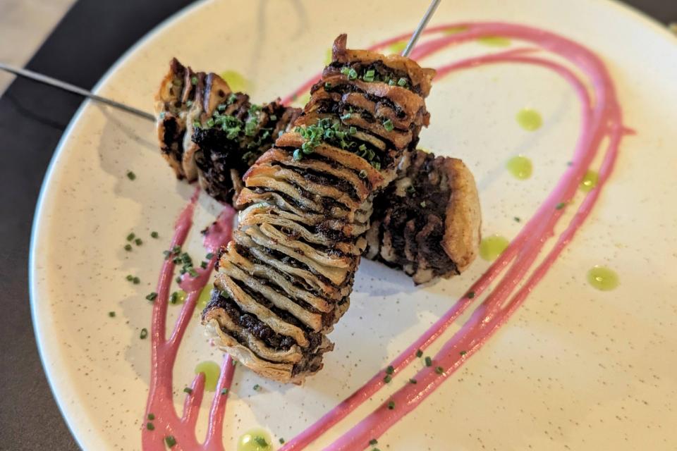  The picture shows a selection of traditional and creative dishes like savoury house-made falafel, king-oyster mushroom skewers