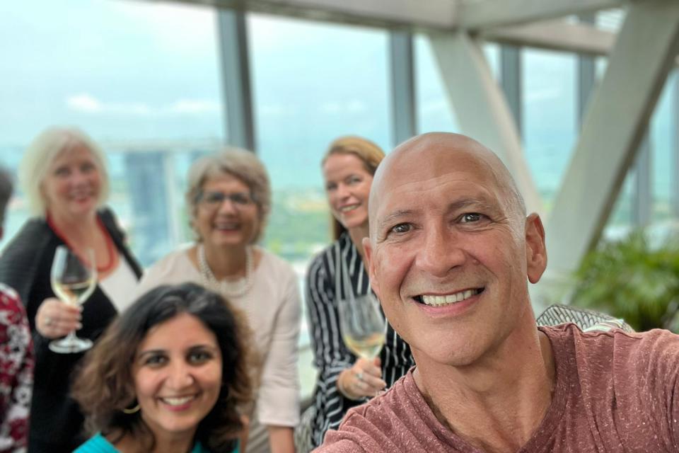 JOhn Gordon Director of Content expat choiuce luxe and expat choice asia with his team of writers in the background showing support for his quest in building sustainable authority in the Expat travel vertical