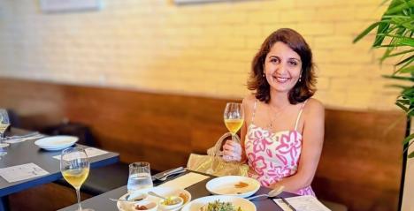 Harnoor Channi-Tiwary Travel writer with Expat choice sitting at a table in Styxx the Singapore restaurant  Styxx
