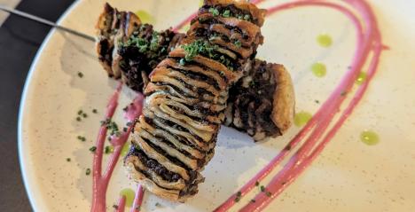  The picture shows a selection of traditional and creative dishes like savoury house-made falafel, king-oyster mushroom skewers