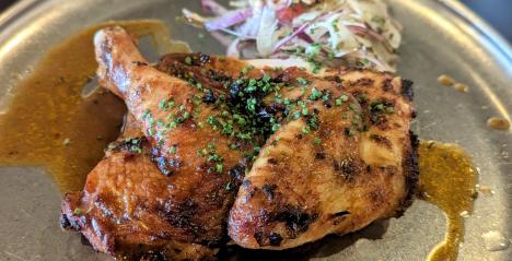 The poisture shows a 24-hour brined Roast Chicken (half for $26, full for $43) smoked over applewood and served with umami-rich jus