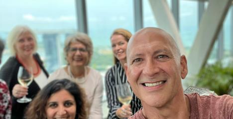 JOhn Gordon Director of Content expat choiuce luxe and expat choice asia with his team of writers in the background showing support for his quest in building sustainable authority in the Expat travel vertical