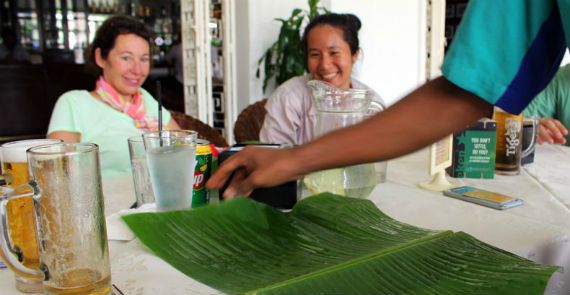 Laying the table with banana leaf