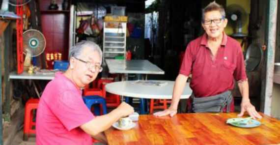 Uncle Ho Kau (Right) with an old friend at his coffee house